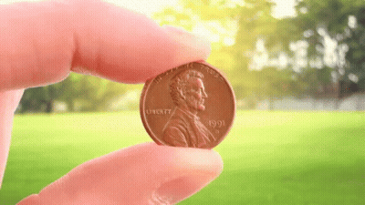 Person Holding Penny Saying Liberty GIF