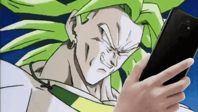 Person Holding Phone In Front Of Dragon Ball Character GIF