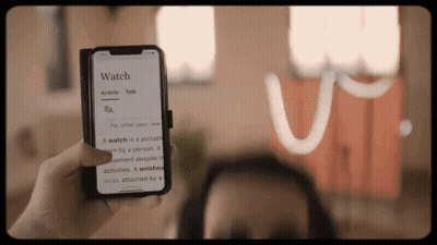Person Holding Phone Saying Watch GIF