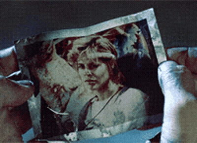 Person Holding Picture Of Woman's Face GIF