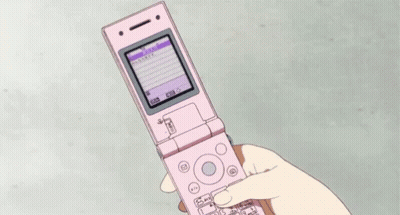 Person Holding Pink Flip Phone With Purple Screen GIF