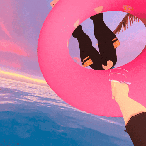 Person Holding Pink Float Remote To Drop GIF