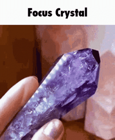 Person Holding Purple Crystal Focus GIF