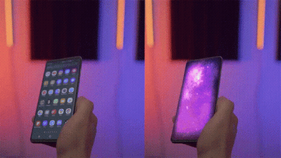 Person Holding Purple Screen Cellphone GIF