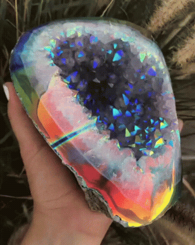 Person Holding Rainbow Rock GIF