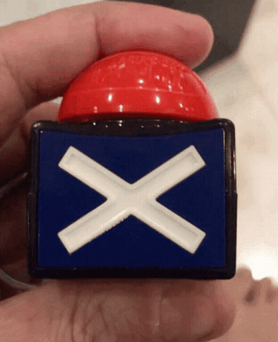 Person Holding Red Button With Blue And White Cross GIF