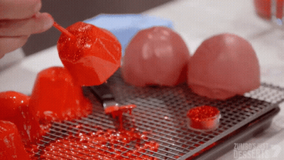 Person Holding Red Candy Stick Zumbos Just Desserts GIF