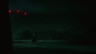 Person Holding Red Lightsaber GIF
