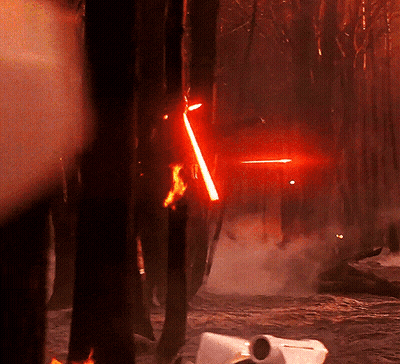 Person Holding Red Lightsaber GIF