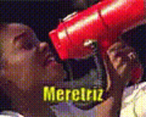 Person Holding Red Object In Front Of Mouth Saying Merciriz GIF