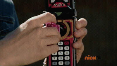 Person Holding Remote With Nick HD Logo