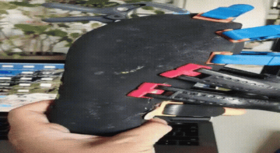 Person Holding Rubber With Clamps GIF