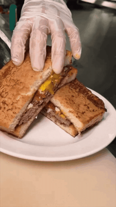 Person Holding Sandwich GIF