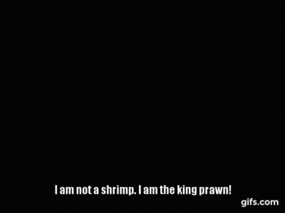 Person Holding Shrimp In Front Of Pepe Sign GIF