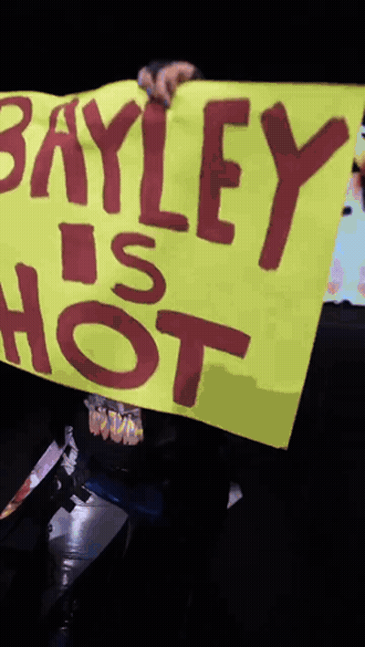 Person Holding Sign Saying Bayley Is Hot GIF