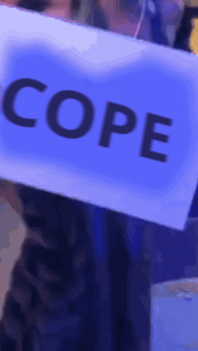 Person Holding Sign Saying Cope GIF
