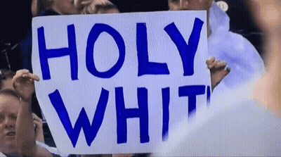 Person Holding Sign Saying Holy White GIF