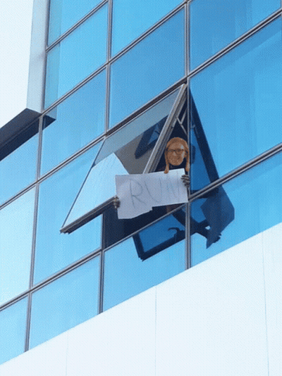 Person Holding Sign Saying Run GIF