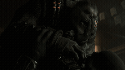 Person Holding Skull In Dark Room GIF