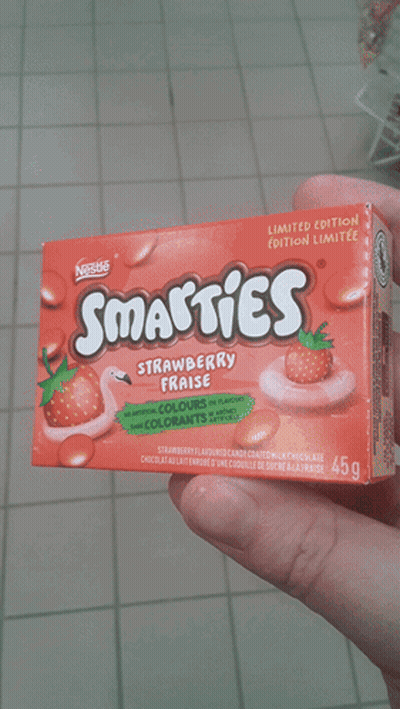 Person Holding Smarties Strawberry Fraise