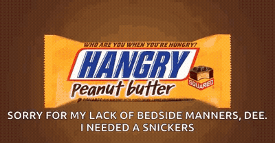 Person Holding Snickers Bar In Front Of Computer GIF