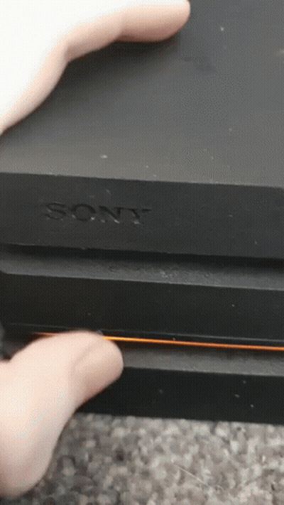 Person Holding Sony Device GIF