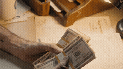 Person Holding Stack Of 100 Dollar Bills GIF
