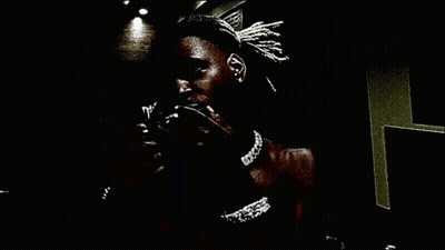Person Holding Stack Of Money In Dark Room GIF