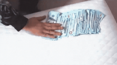 Person Holding Stack Of Money With 10 GIF