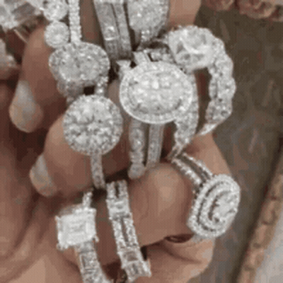 Person Holding Stack Of Rings GIF