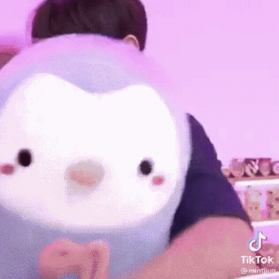 Person Holding Stuffed Animal GIF