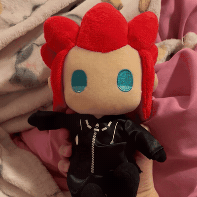 Person Holding Stuffed Doll With Red Hair And Black Jacket GIF
