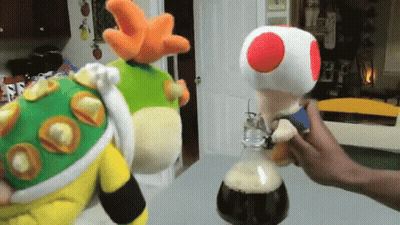 Person Holding Stuffed Toad With Red Spot GIF