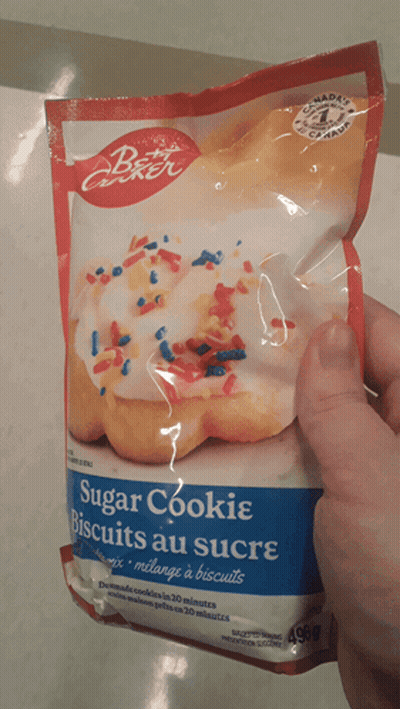 Person Holding Sugar Cookie Mix GIF