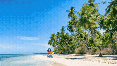Person Holding Surfboard on Tropical Beach