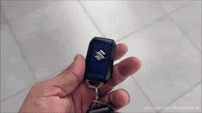 Person Holding Suzuki Key Fob GIF