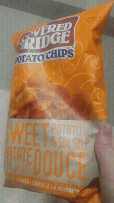 Person Holding Sweet Potato Chips GIF