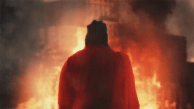 Person Holding Sword With Lightning Behind GIF