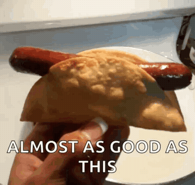 Person Holding Taco And Hot Dog GIF