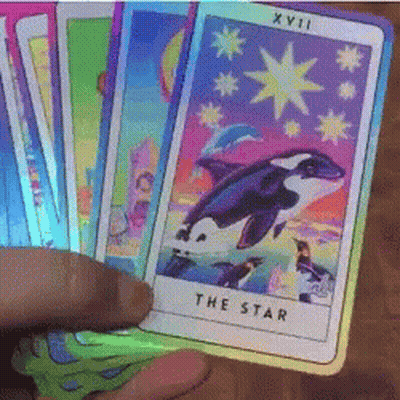 Person Holding Tarot Deck With Star Card GIF