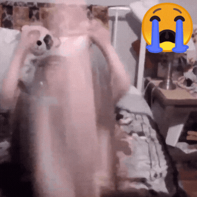Person Holding Teddy Bear With Crying Face Behind GIF