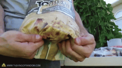Person Holding Tortilla Chips With Website GIF