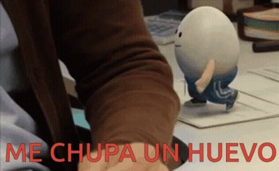 Person Holding Toy Egg Saying Me Chupa Un Huevo GIF