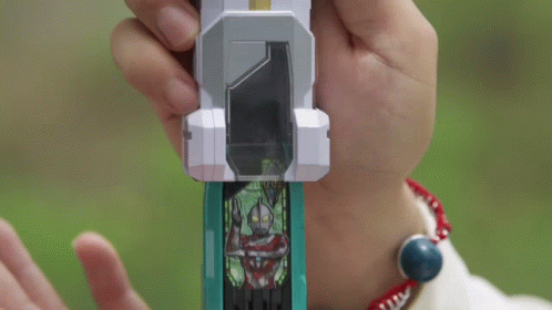 Person Holding Toy In Hands And Looking At It GIF