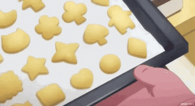 Person Holding Tray Of Cookies GIF