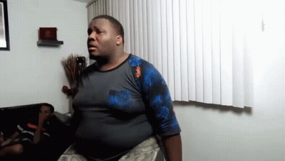 Person Holding Two Boxes Of King's Bridges And Raptor Rush GIF