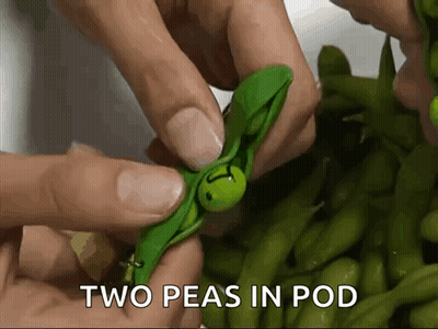 Person Holding Two Peas In Pod GIF