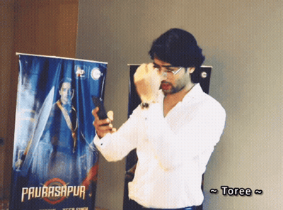 Person Holding Watch Showing 7:55 GIF