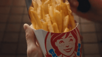 Person Holding Wendy's Fries Container GIF