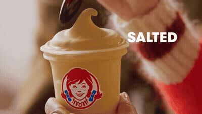Person Holding Wendy's Ice Cream With Spoon GIF